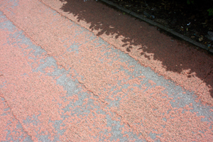 Red tarmac breaking up